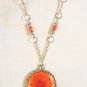 N2 - Red beaded necklace with flower pendant
