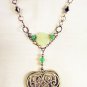N10 - green and black beaded necklace with filigree heart pendant
