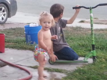 Model playing outSide in her fish diaper