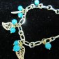 Gold chain with green leather bracelet