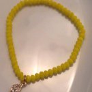 Yellow Faceted Stretch Bracelet with Gold Rhinestone Charm