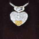 FINE 1.00 CT DIAMOND 18KT GOLD HEART PENDANT ON CHAIN.