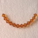 Topaz Cut Glass Crystal Bicones beads (6MM)