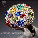 FLOWERBED STERLING SILVER WHITE AND MULTICOLORED CRYSTAL STUDDED FLOWERS RING