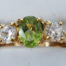 1016) Goldtone  Green & Clear CZ Ring SZ 8 1/2