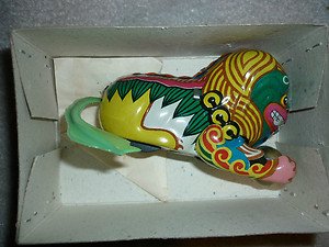 Chinese Dragon (cat, dog ?) windup wind up rollover tin toy