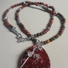 Brown agate pendant on tigers and tibetan bead necklace
