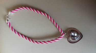 Bright pink and white kumihimo braid with a heart