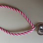 Bright pink and white kumihimo braid with a heart