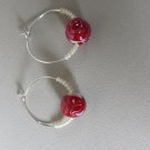 Hoop earrings with lemon seed and red bead