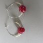 Hoop earrings with lemon seed and red bead