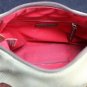 Dooney and Bourke Pebbled Leather Hobo Handbag in Cream Yellow