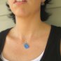 Titanium Floating Ghost Halloween Necklace also with handmade titanium findings on rubber cord