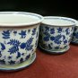 blue and white set of three planters with dishes, 6", 8", and 10" wide
