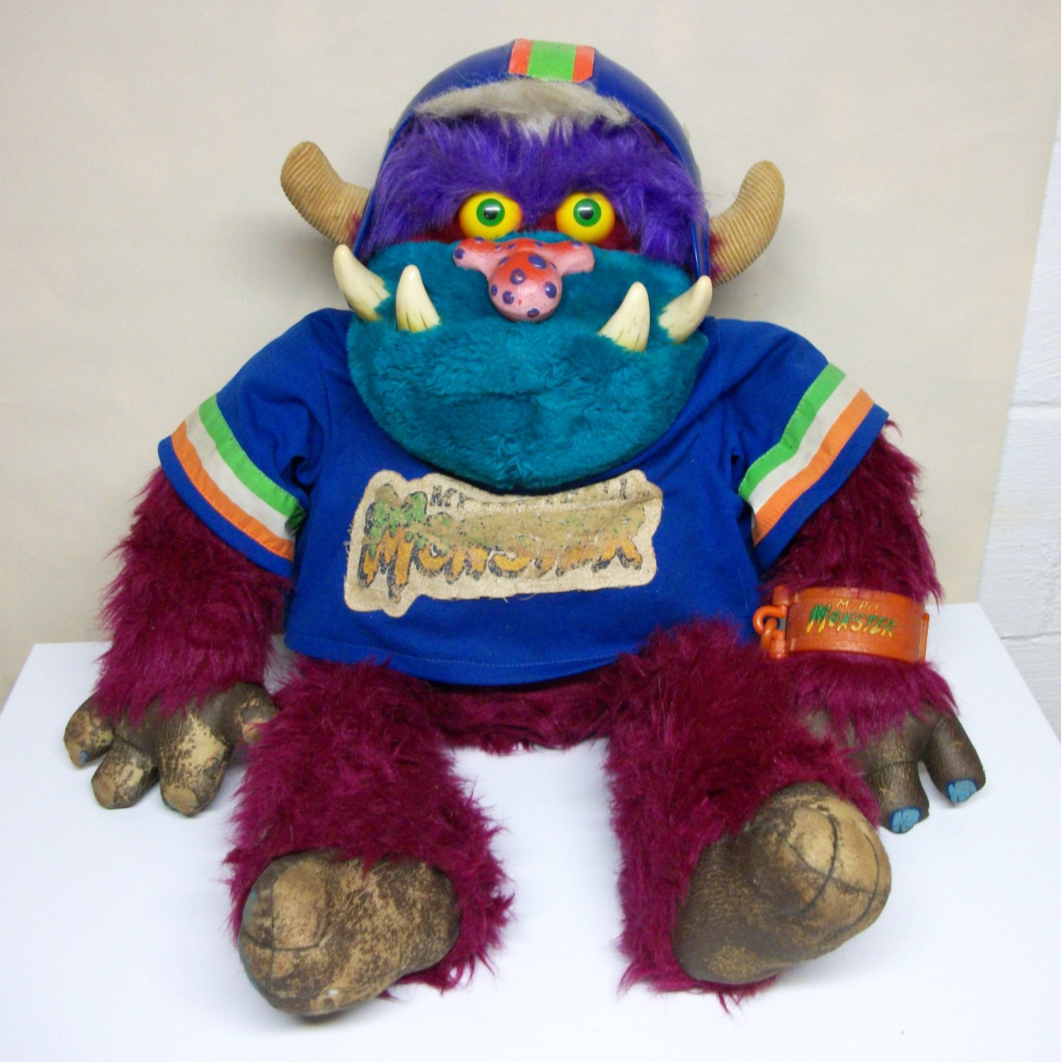 80s toy monster with handcuffs