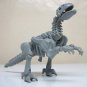 1988 Bone Age Dynacus figure loose vintage deinonychus raptor dinosaur gray skeleton Kenner
