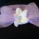 White flower, purple bow, purple band