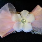 White flower on pink bow
