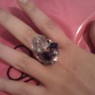 serrated silver colored ring