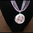 Glass pendant necklace on ribbon cord necklace