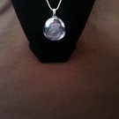 Blue glass pendant necklace on silver snake chain
