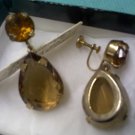 Antique screwback earrings in amber topaz and smoky topaz mounted in gold metal