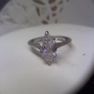 Silvertone ring marked NR with crystal sparkler in size 8-9