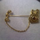 Avon "Young Reflections Telephone Pin" in goldtone 1981