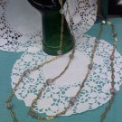 54 inch vintage Aurora Borealis crystal necklace on goldtone filigree chain