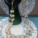 Avon four strand goldtone and faux pearl necklace
