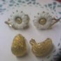 2 pair Crown Trifari goldtone clip earrings one textured and one daisies