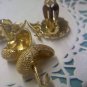 2 pair Crown Trifari goldtone clip earrings one textured and one daisies