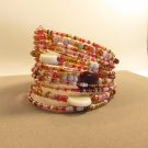 Handmade Indonesian Tribal Seed Bead Bracelet Cuff adorned shell, stone chips, and glass beads.