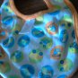 Baby boy's orange and white trucks bib one size