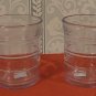 Two ice blue juice glases with prominent rings, slightly flared rim