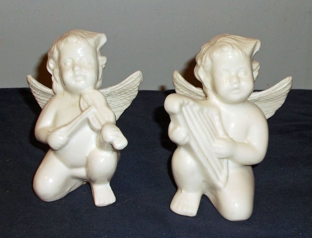 Pair of White Ceramic Cherub / Angel Figurines Playing Lyre and Viiolin
