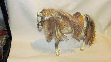 WHITE HORSE WITH SADDLE
