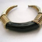 Black enamel gold tone metal spring cuff bracelet 1/2" adjustable