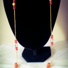 Gold plated long necklace with red beads