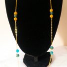 Gold plated long necklace with blue beads
