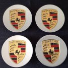 OEM Porsche Center Caps Made in Italy Silver 65mm, set of 4. Caps fit OEM Porsche rims.