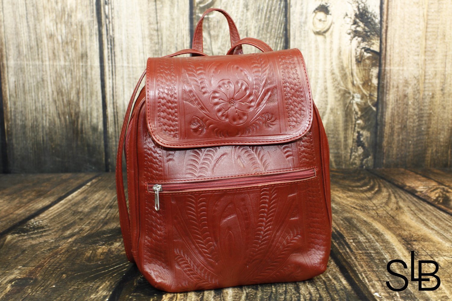 red tooled leather purse