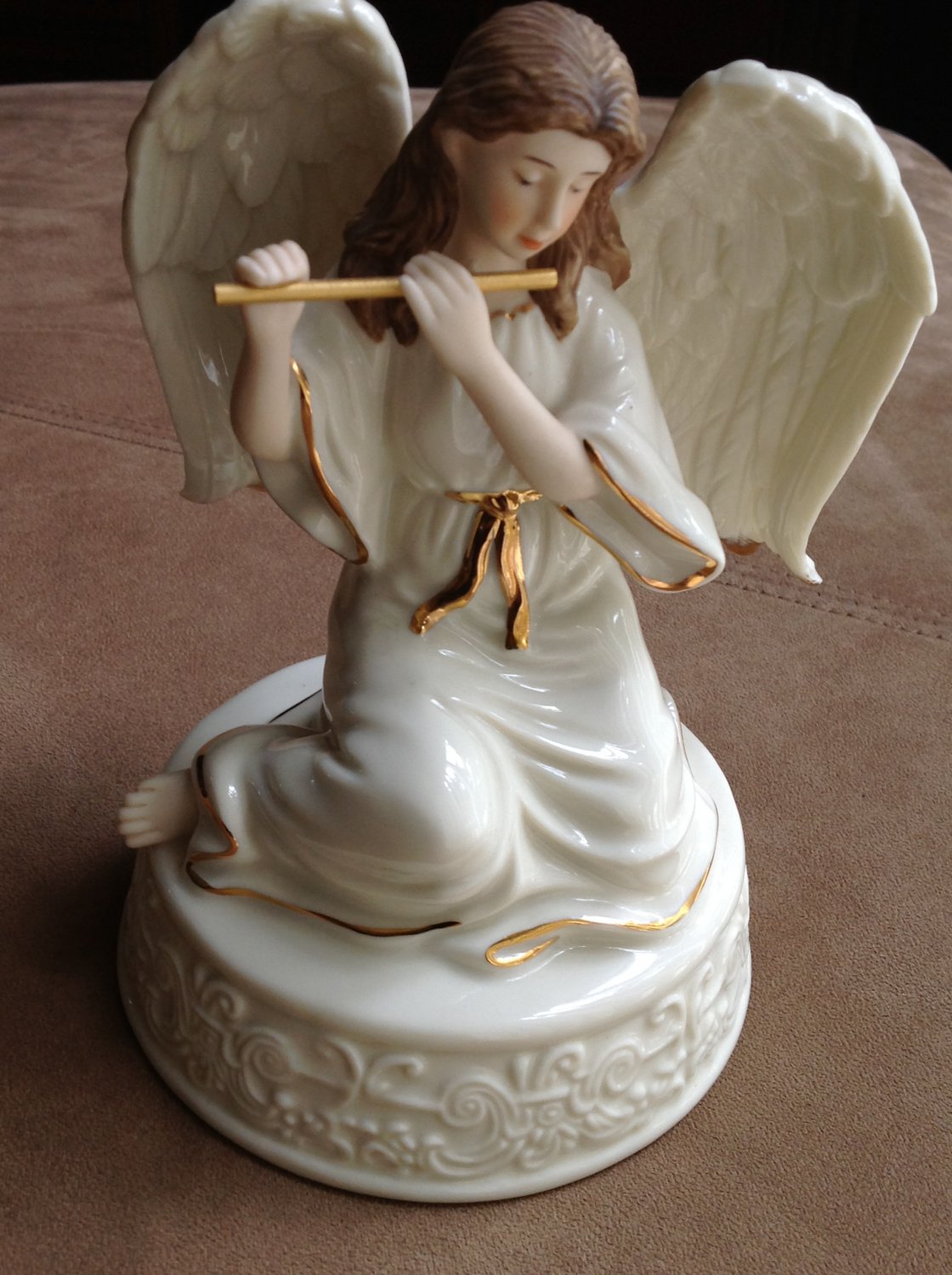 7" Angel figurine, with music box, gold trim, holding flute