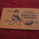 2004 Monopoly Board Game Piece: Advance to Boardwalk Chance Card