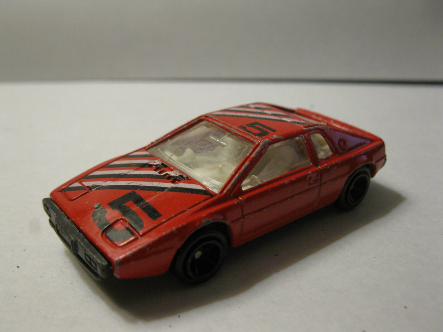 vintage Diecast car: Red w/ Black & White stripes #4