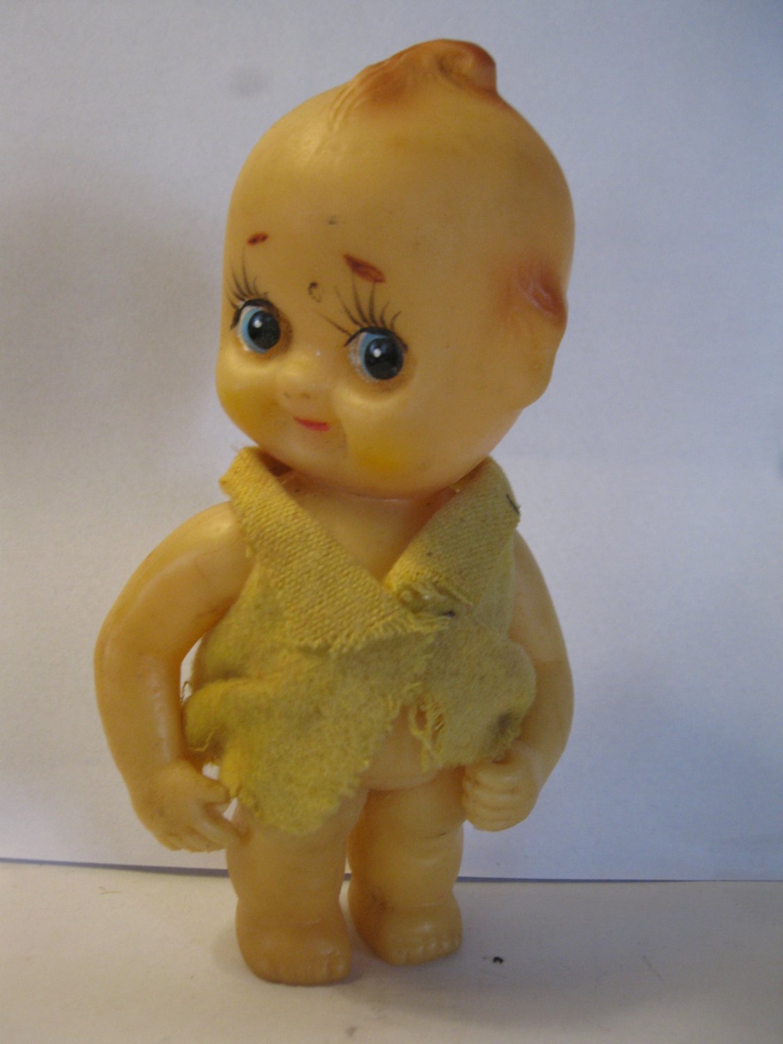 (BX-7) very old 5" big head baby doll wearing yellow shirt