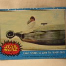 1977 Star Wars - a New Hope Trading Card #25: Luke rushes to save his loved ones
