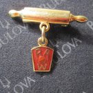 vintage enamel Lapel Pin: gold Rolling Pin w/ dangling R.A.W.