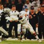 John Elway Autographed 16x20 Against Raiders Photo- JSA Authenticated