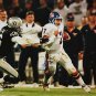 John Elway Autographed 16x20 Against Raiders Photo- JSA Authenticated